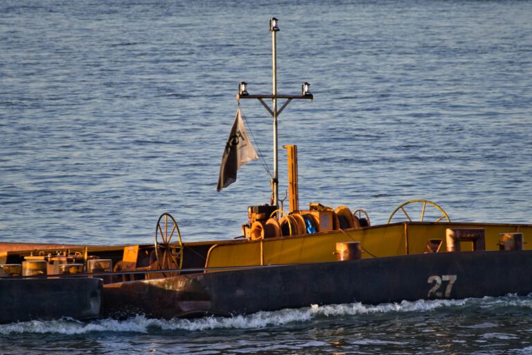 A pusher boat on an inland waterway, highlighting transportation and logistics.